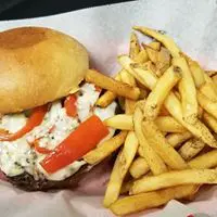 A sandwich and fries are on the table.